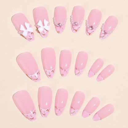 Almond Shaped Nails with Ombre Pearl and Bow Design