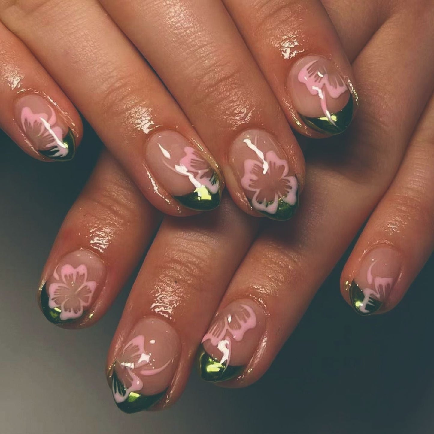 Shimmering Green French Short Oval Nails with Pink Flower Designs