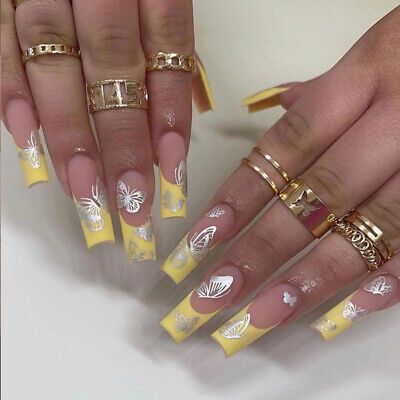 Yellow French Tip Nails with Silver Butterfly Design